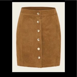Suede skirt with gold snap buttons down the front.